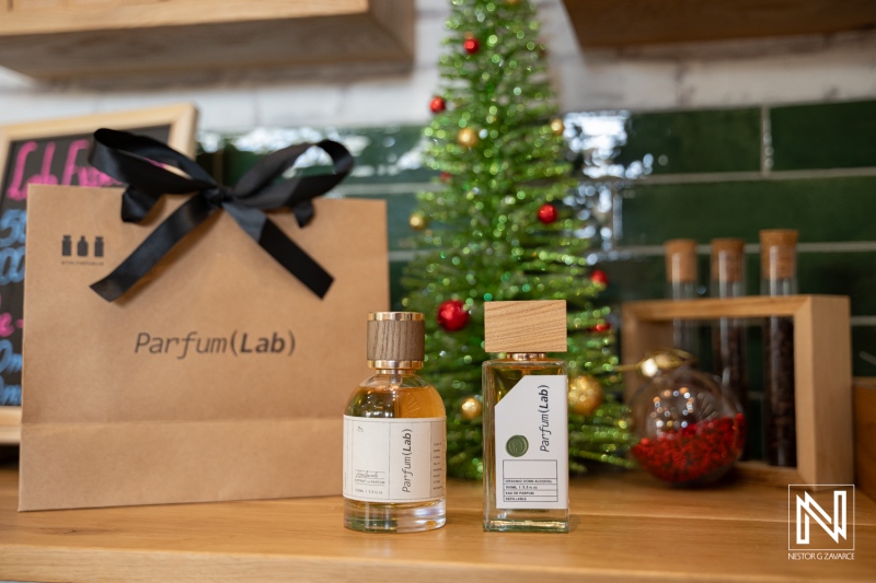 ParfumLab Curacao presents product display with festive decor and branding elements