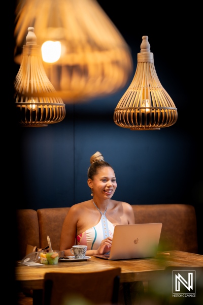 Branding photoshoot for Van den Tweel Supermarket in Curacao featuring a woman working