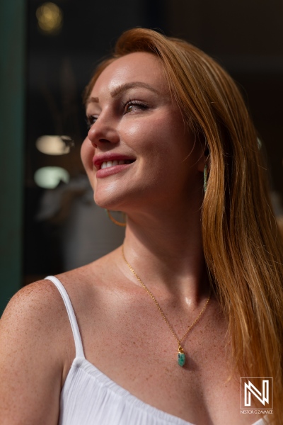 Product photoshoot for ParfumLab Curacao featuring a woman with long hair in sunlight