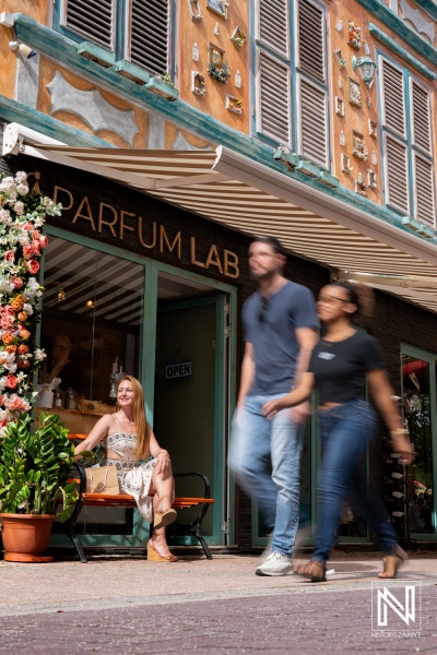 Product photoshoot for ParfumLab in Curacao with people walking by in a busy street