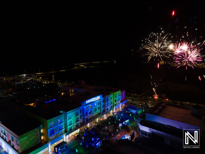 Celebration of corporate event in Curacao with fireworks lighting up the night sky and vibrant festivities at the venue
