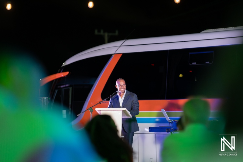 Dynamic corporate event speaker engaging audience outdoors at a Curacao venue