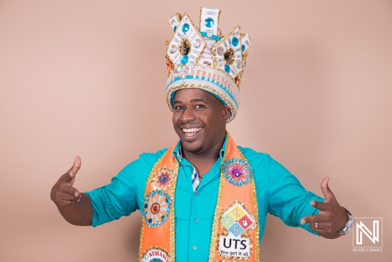 A Joyful Man Wearing an Elaborate Crown and Colorful Sash Celebrates a Special Occasion in a Studio With a Neutral Background