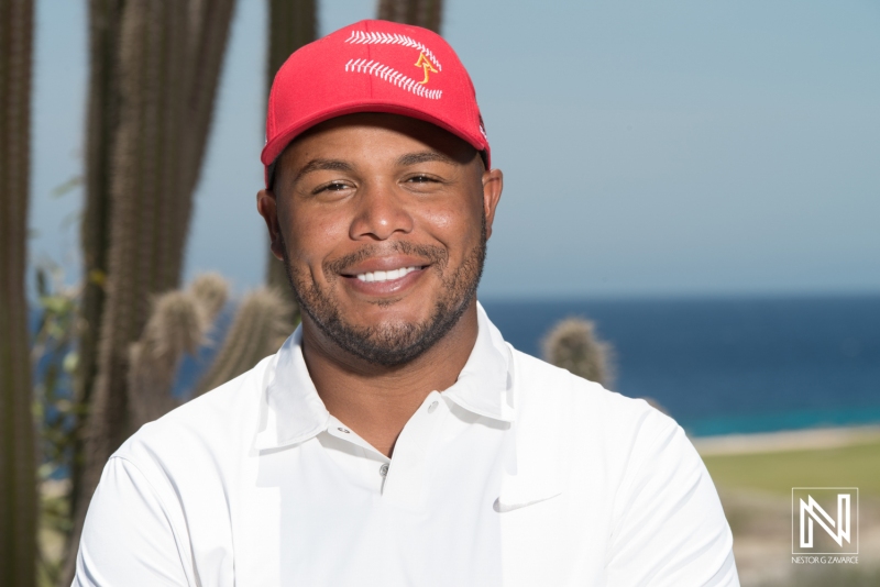 A Smiling Golfer Poses Against a Tropical Backdrop With the Sea in the Background During a Sunny Day, Highlighting the Excitement of Golf in a Picturesque Location