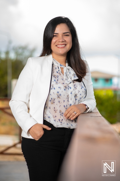 Professional Woman Stands Confidently at a Park Railing During Daylight, Showcasing a Casual yet Polished Look, Ideal for a Business Profile or Personal Branding