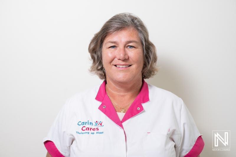 A Friendly Healthcare Professional Poses in a Bright Uniform, Showcasing a Welcoming Smile at a Medical Facility During Daylight