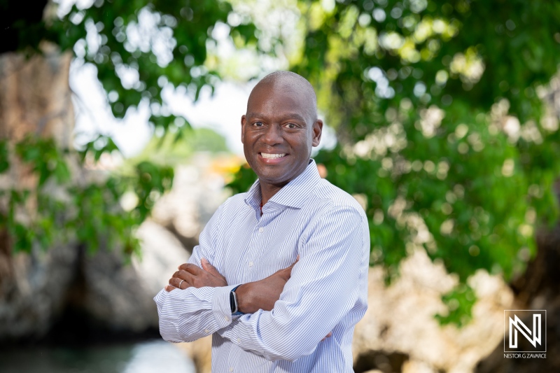 Corporate headshot in Curacao featuring an adult man standing outdoors by the water