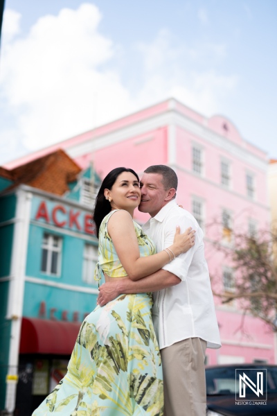 A Couple Embraces Each Other in a Vibrant, Colorful Setting During a Sunny Day in a Lively City