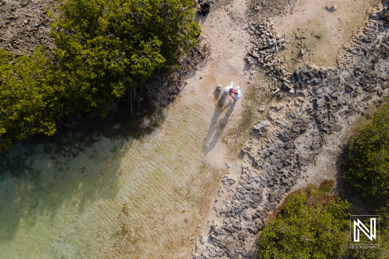 Drone shot with couple at Doggy Beach Curacao