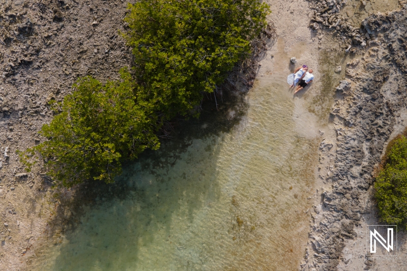 Drone shot with couple at Doggy Beach Curacao