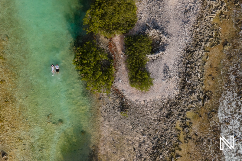 Drone shot with couple at Doggy Beach Curacao