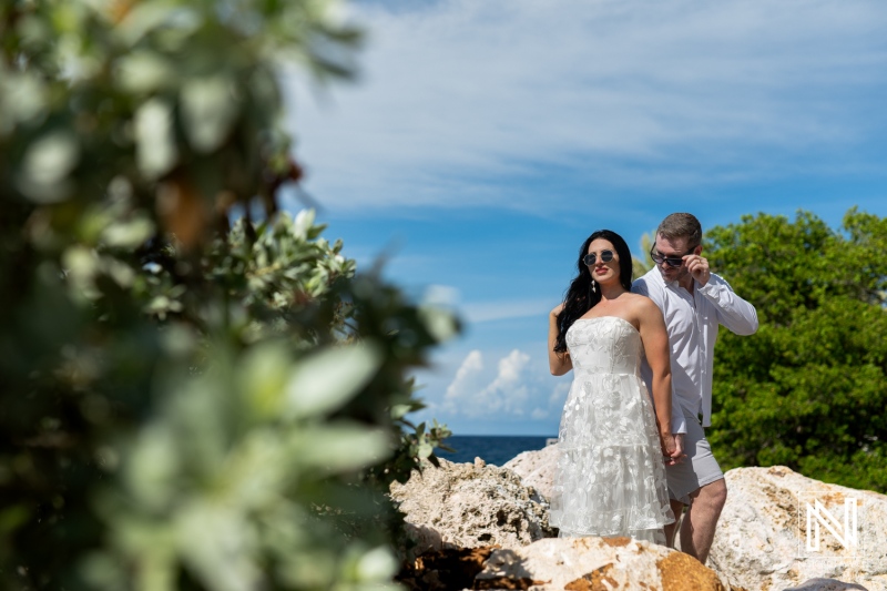 Couple enjoying a romantic moment at Baoase Luxury Resort in Curacao under a clear blue sky