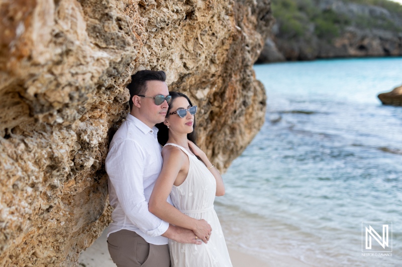 Couple enjoying a romantic moment at Cas Abao Beach in Curacao during a sunny day surrounded by nature