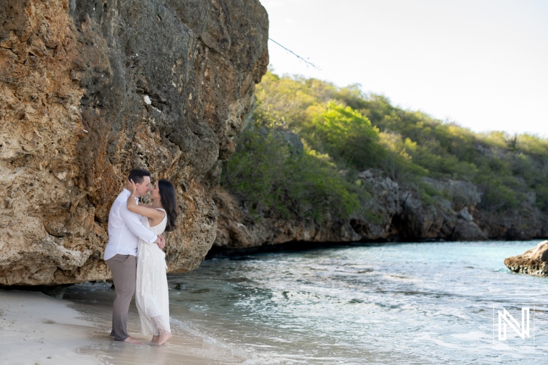 Couple enjoying a romantic moment at Cas Abao Beach in Curacao during a sunny day