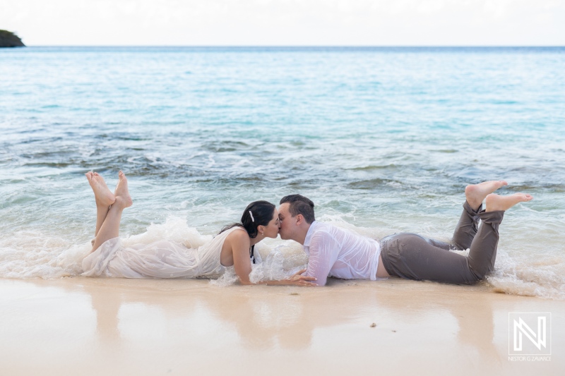 Couple enjoying a romantic kiss on a beautiful Cas Abao Beach in Curacao during a sunny day