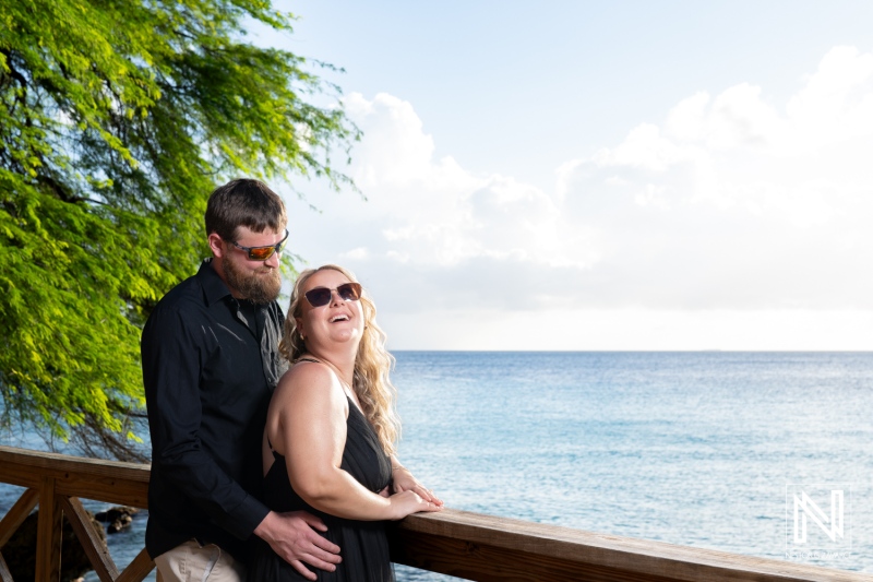Couple enjoying a romantic moment by the sea in Curacao during a sunny day