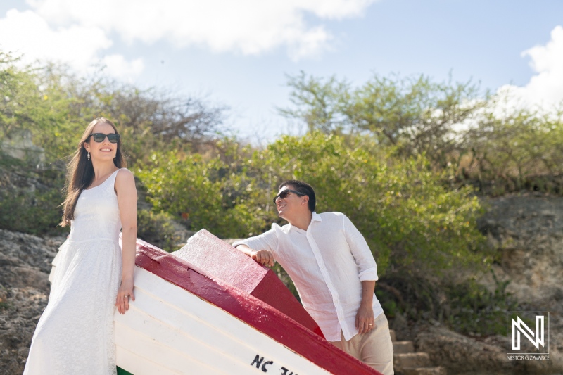 Couple enjoys a romantic sunrise photoshoot at Playa Porto Mari in Curacao amidst natural beauty and scenic surroundings
