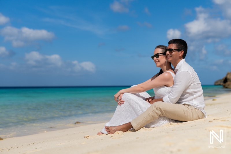 Couple enjoys a romantic sunrise photoshoot on the serene shores of Playa Porto Mari in Curacao