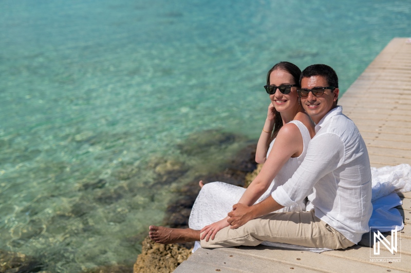 Romantic couple photoshoot at Playa Porto Mari during a picturesque sunrise in Curacao