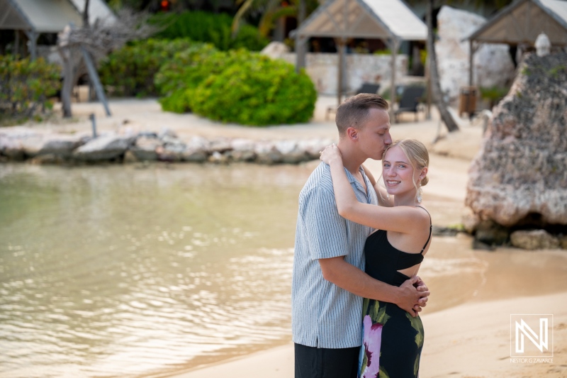 Couple enjoys photoshoot at Baoase Luxury Resort in Curacao during warm day near the beach