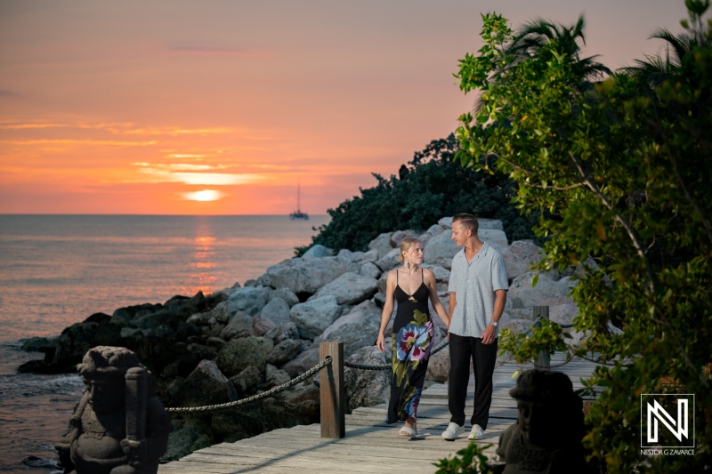 Couple enjoys sunset stroll at Baoase Luxury Resort in Curacao during their photoshoot