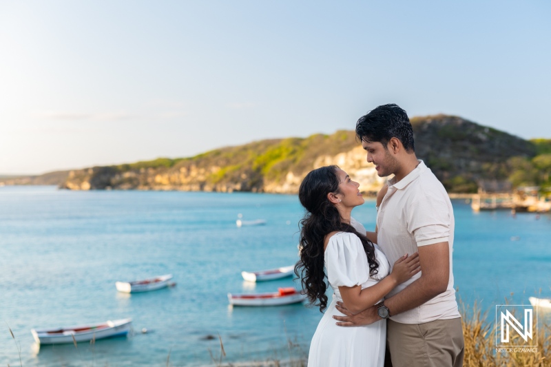 Couple enjoys romantic engagement session at sunset in St. Michiel, Curacao with breathtaking views of Boka Sami bay