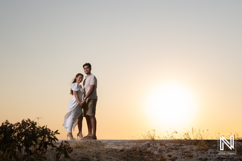 Engagement session capturing a couple at sunset in St. Michiel, Curacao with a stunning Boka Sami backdrop