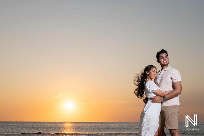 Couple enjoys a romantic engagement session at St. Michiel, Curacao during a stunning sunset at Boka Sami beach