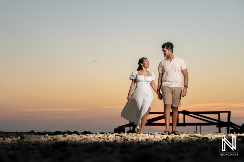 Couple enjoys romantic engagement session during sunset at St. Michiel in Curacao, capturing magical moments by Boka Sami