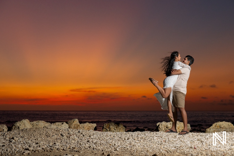 Engagement session captures couple at sunset in St. Michiel, Curacao overlooking Boka Sami coastline
