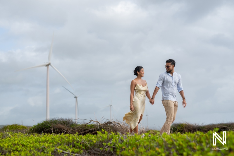 Engagement session at Vlakte di San Pedro showcases a romantic couple amidst stunning windmills in Curacao