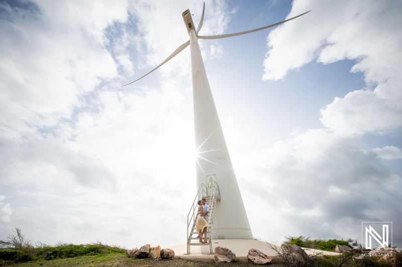 Engagement session captures love and joy at Vlakte di San Pedro in Curacao under the scenic wind turbine
