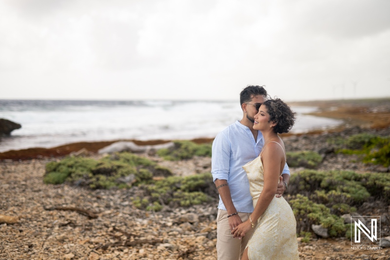 Engagement session at Vlakte di San Pedro in Curacao captures love by the sea with lush landscapes and gentle waves