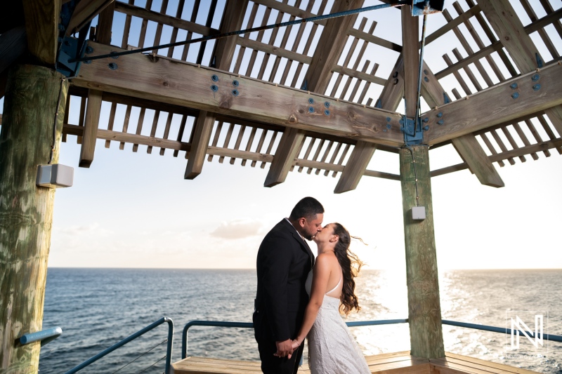 Engagement celebration on a charming pier in Curacao during a stunning sunset