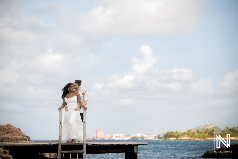 Engagement session at Marie Pampoen in Curacao with couple enjoying their moment by the water during daytime