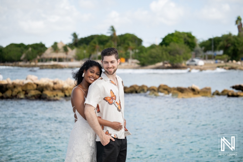Couple enjoys engagement session at Marie Pampoen beach in Curacao during sunny day