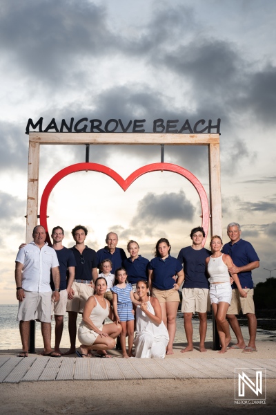 Family gathering at Mangrove Beach in Curacao during sunset celebration with joy and togetherness