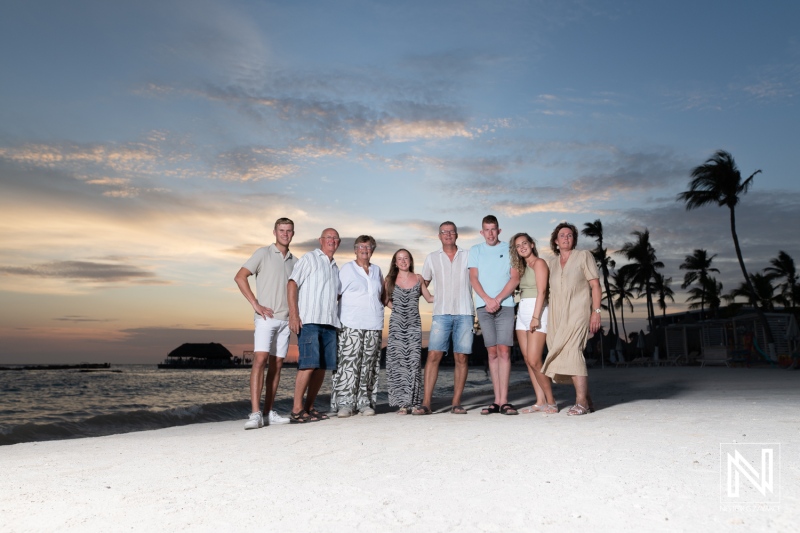 Family gathering on the beach at sunset in Curacao creates lasting memories