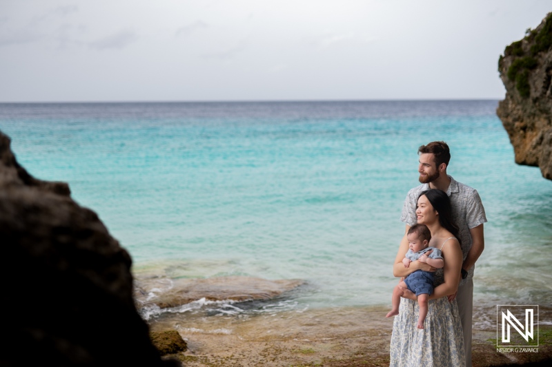 Family and friends enjoy a memorable photoshoot by the scenic coast of Curacao capturing moments of love and joy