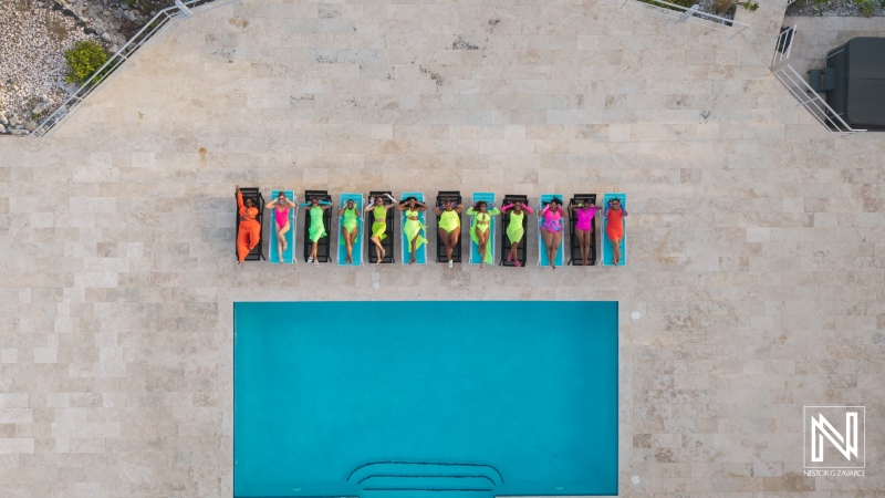 Family and friends relax by the pool in Curacao during vacation time