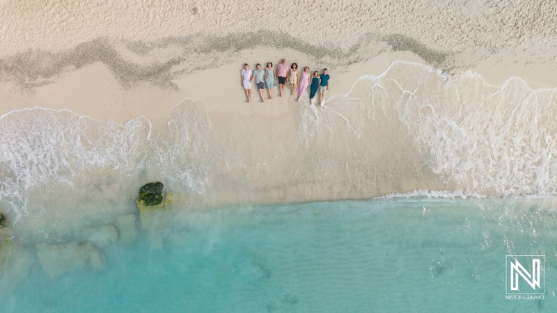 Family gathers on the beach in Curacao during a fun vacation