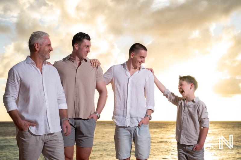 Family gathering in Curacao during sunset with four members enjoying time together