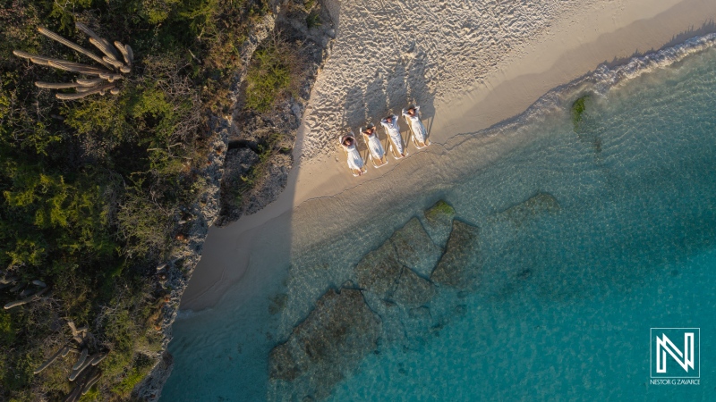 Family and friends enjoy time together on a beach in Curacao during a vacation photoshoot