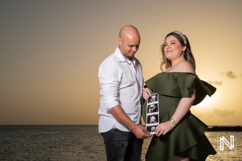 Expecting parents celebrate maternity on the beach in Curacao during a stunning sunset