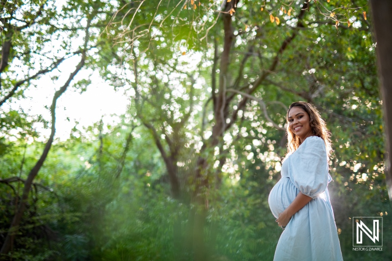 Celebrating motherhood in the lush greenery of Curacao during a serene maternity photoshoot