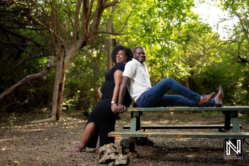 Beautiful maternity photoshoot in Curacao showcasing a couple in a serene outdoor setting, celebrating pregnancy and love during a sunny day
