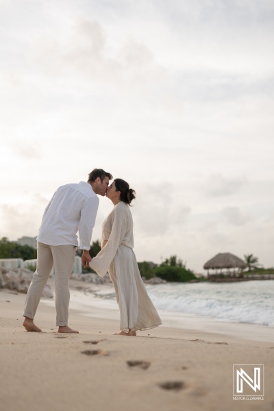 Maternity photoshoot capturing a couple's love on the beautiful beaches of Curacao during sunset