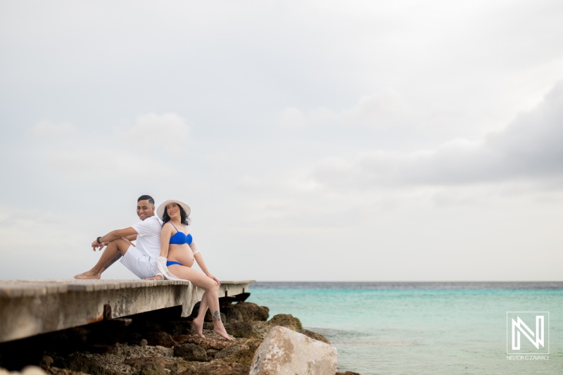 Maternity photoshoot at a beautiful beach in Curacao capturing moments of joy and anticipation during pregnancy