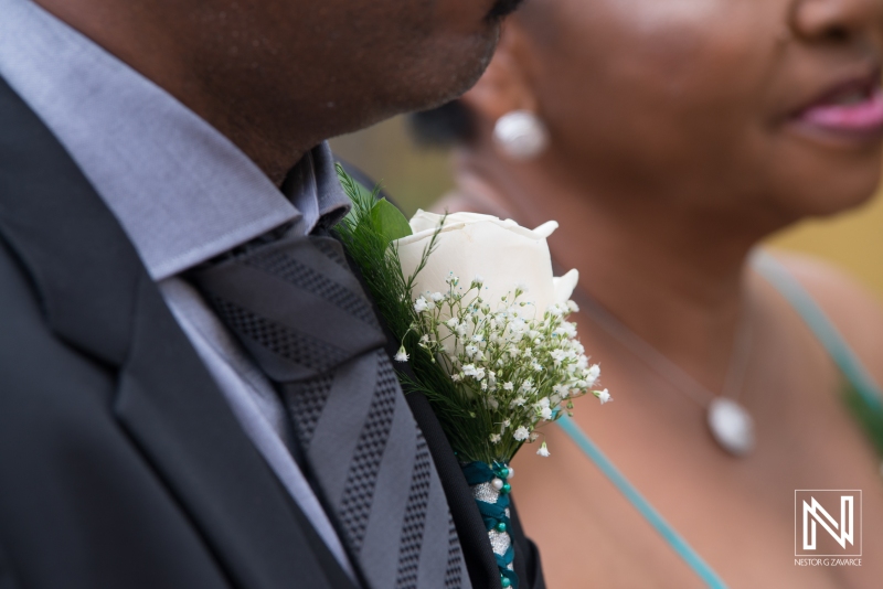 Groom boutonniere with white rose