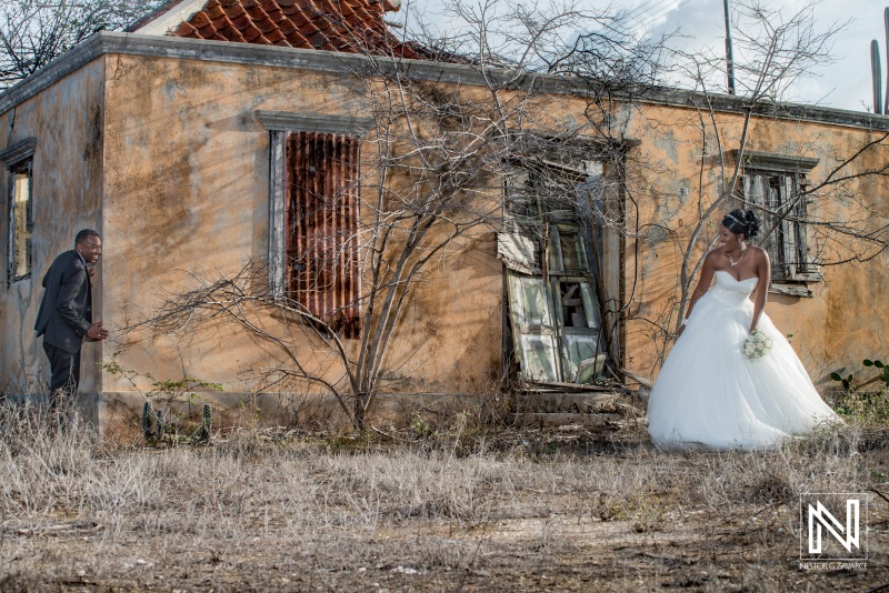 Bride and groom next to old house ruins photoshoot